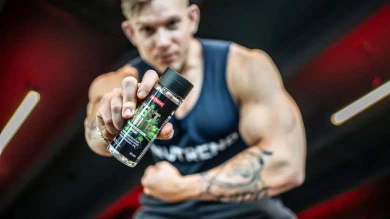 Man holding supplement bottle